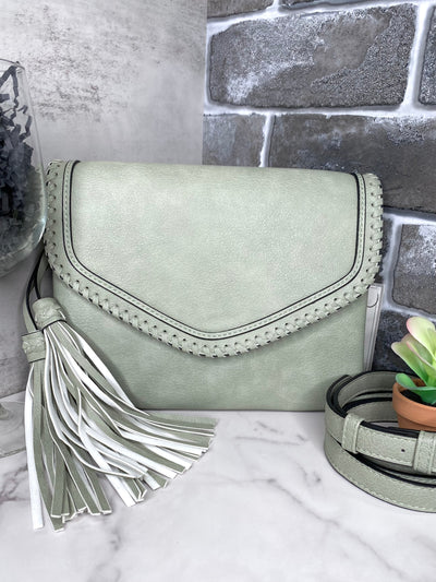 Sloane Flapover Crossbody w/ Whipstitch and Tassel: Lt. Sage-Authentically Radd Women's Online Boutique in Endwell, New York
